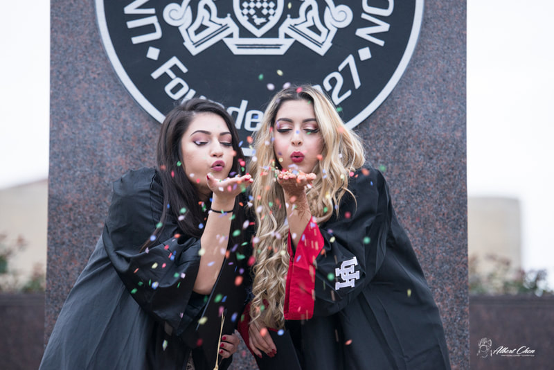 two girls playing with confetti 