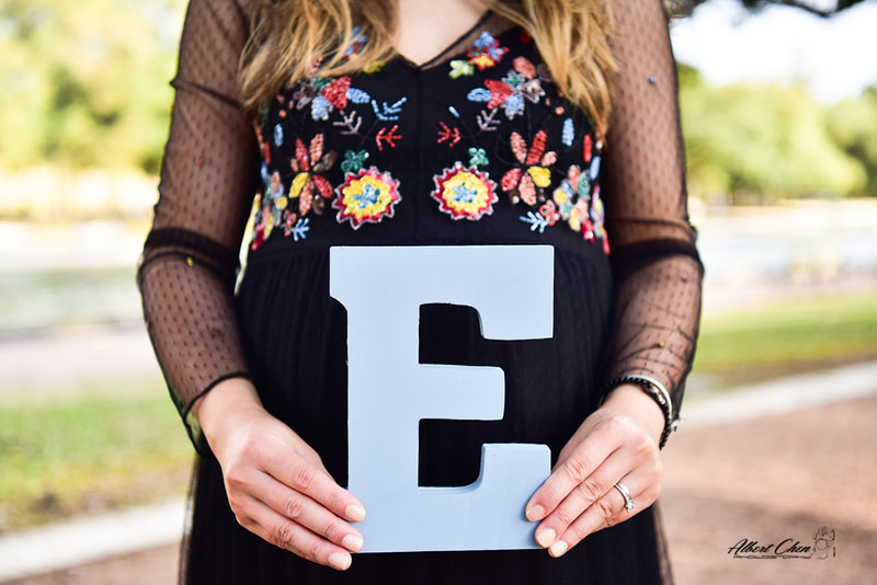 a mother-to-be showing her expecting kid's name