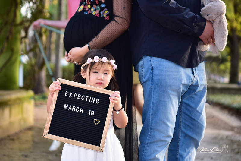 a family showing the baby's expecting date