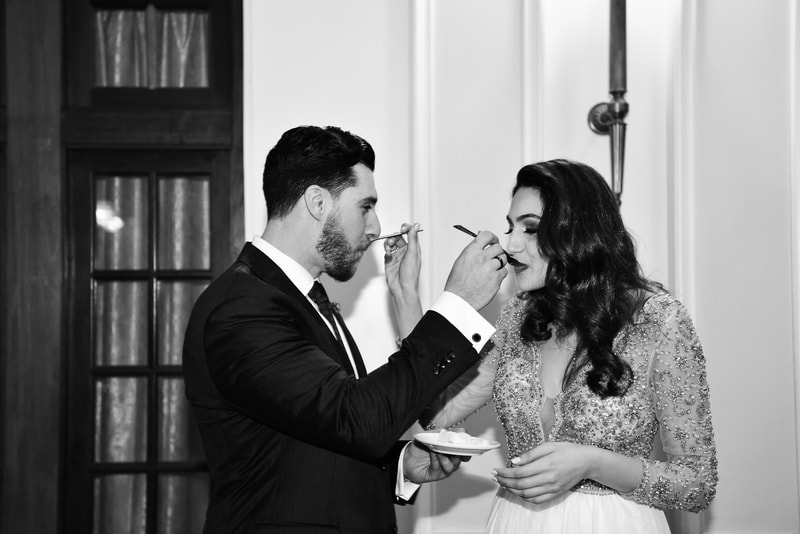 couple eats cake at the wedding reception