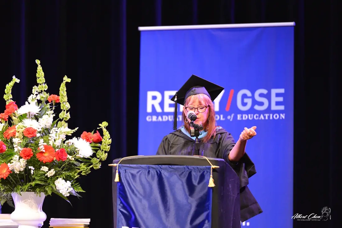 College president giving a speech on a graduation event