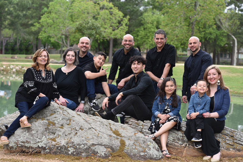 a family photo with large group members in a park near katy, tx