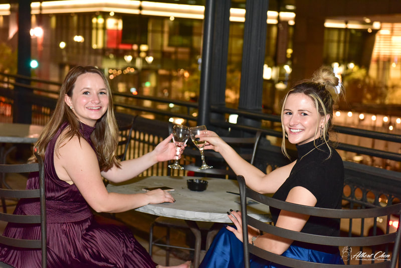 two girls toasting in an corporate event