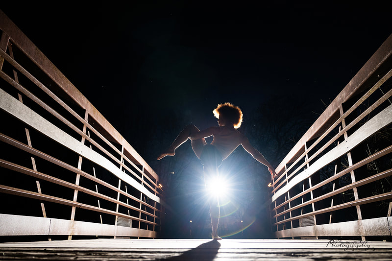 backlit shot for a dancer on a bridge