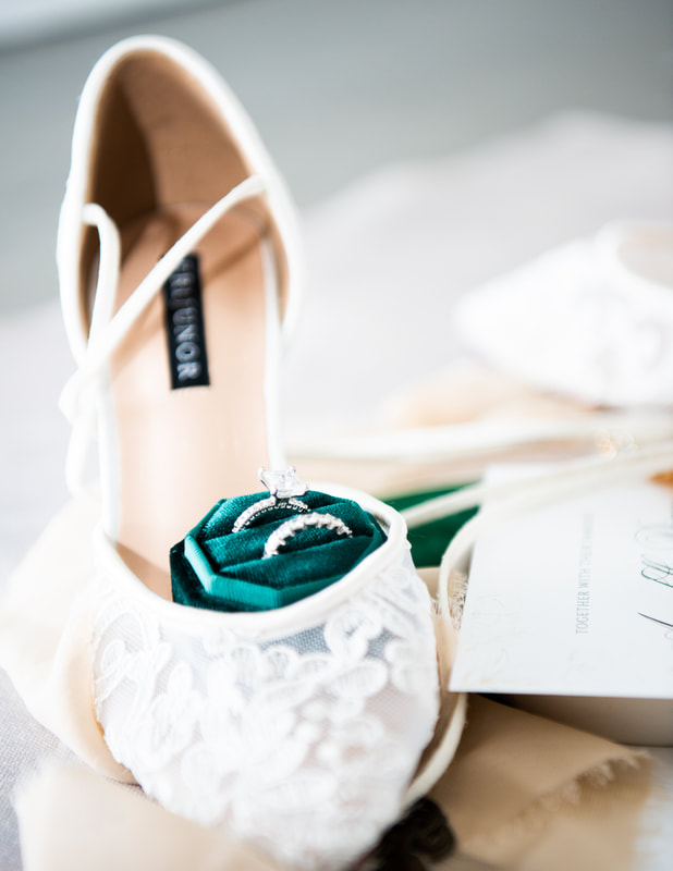 wedding ring with bride's shoes