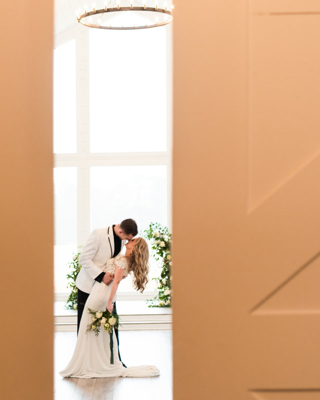 wedding photo with door as foreground