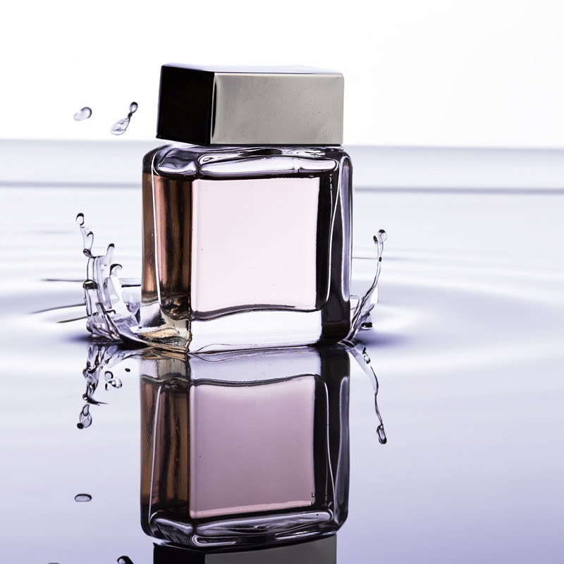 Perfume product with splash water, reflection, and ripple