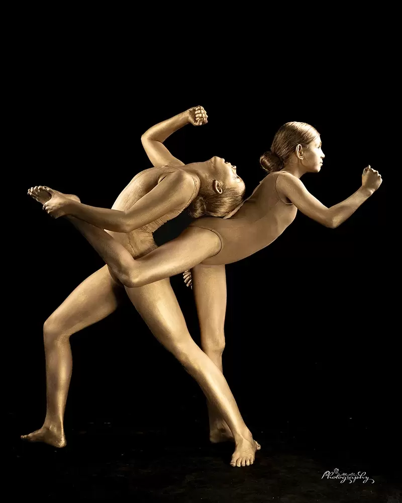 Two performing dancers